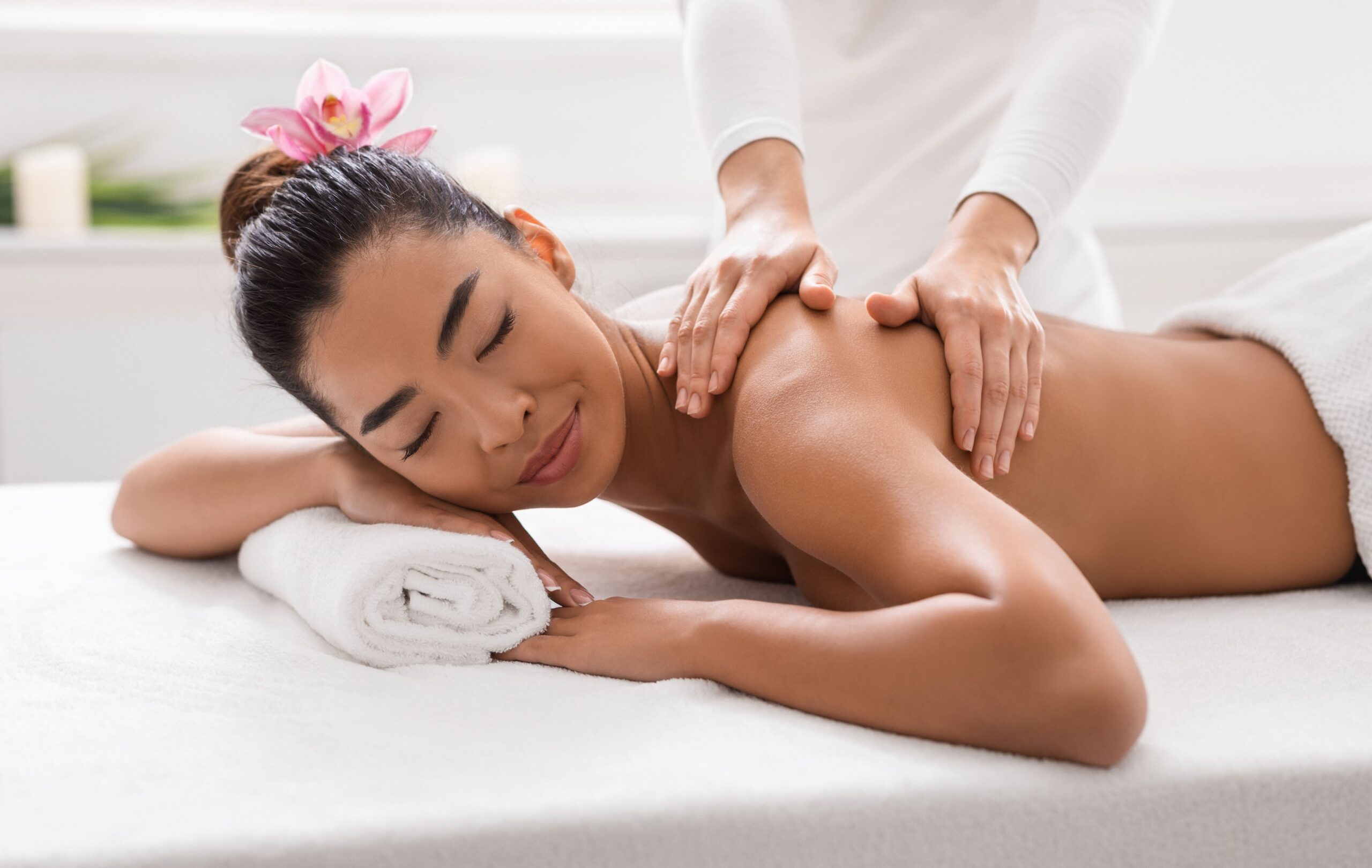 relaxed-asian-woman-pampering-herself-with-body-ma-2023-11-27-04-48-59-utc-1-scaled.jpg